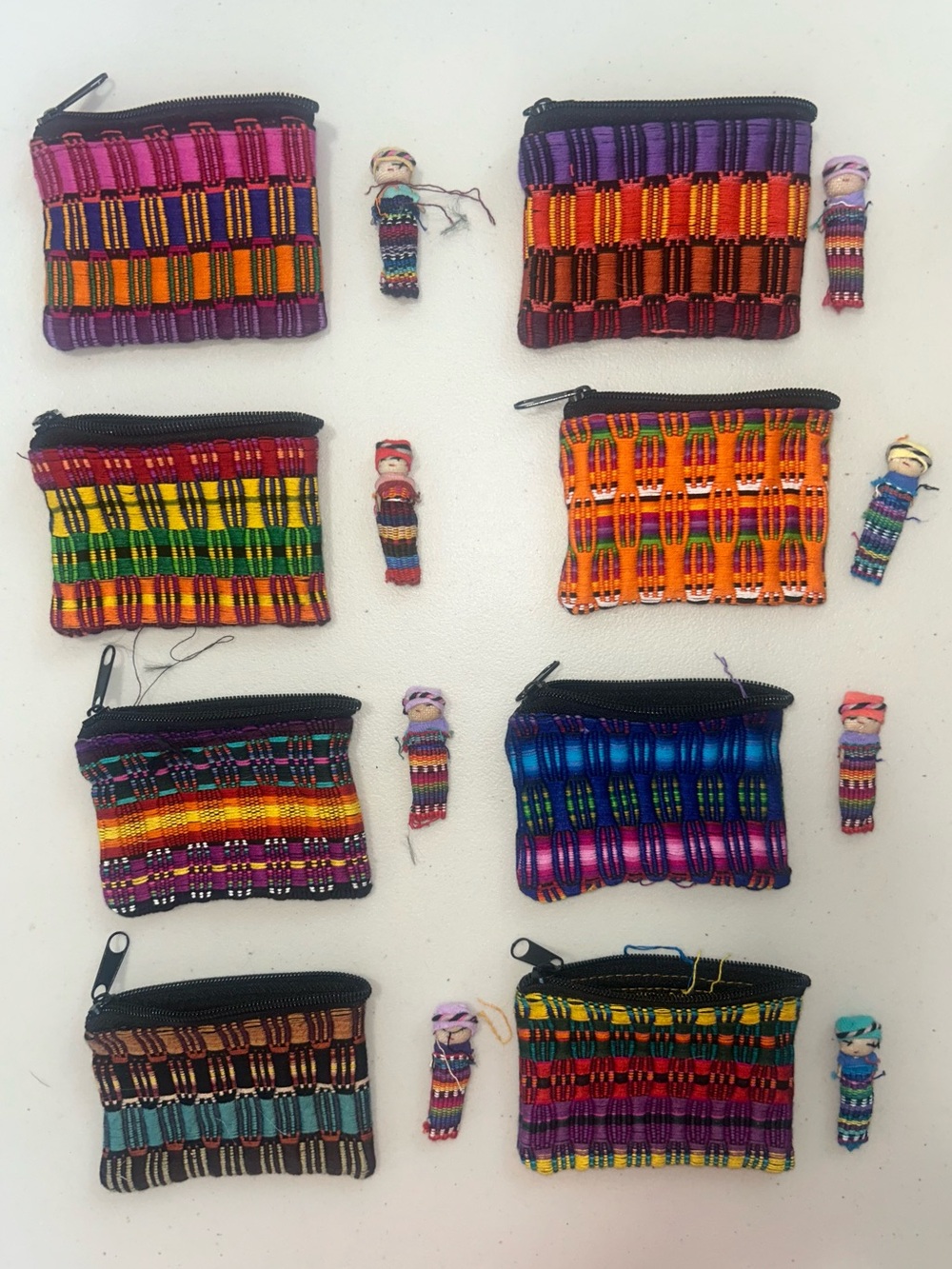 Set of Colorful Handwoven Mini Coin Pouches with Tiny Doll Charms set of 8